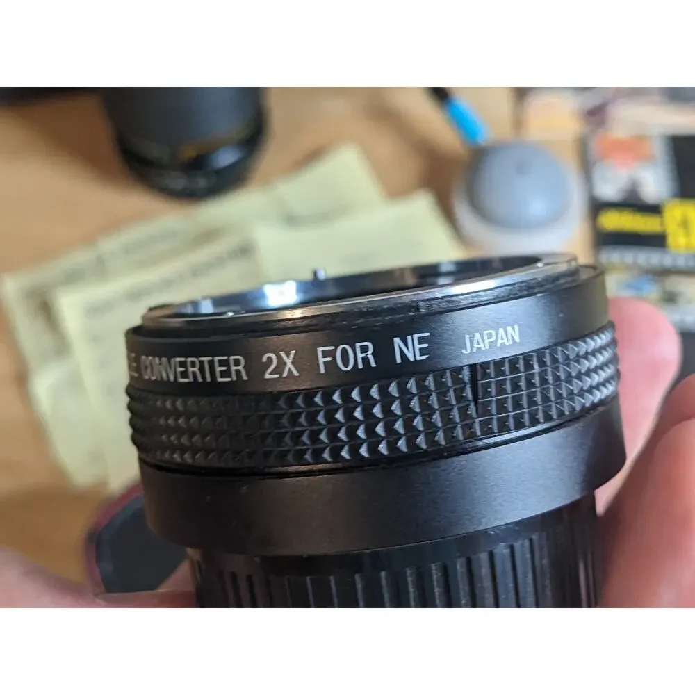 Nikon EM Black body 50mm Series E + Auto Tele Converter + Bag + Kalimar Light +